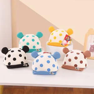 Detailed view of baby cotton baseball hats with colorful polka dots and cute 3D ears