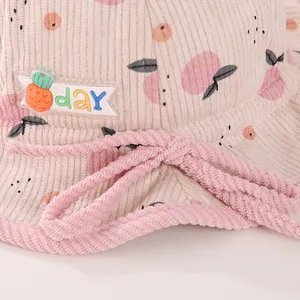 Warm corduroy baby bucket hat with fruit print and decorative drawstring for kids