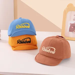 Rainbow letter corduroy baby baseball caps in blue yellow and brown for toddlers