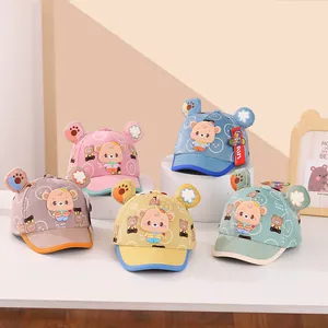 Close-up of cute cartoon bear baseball caps in five vibrant colors for toddlers