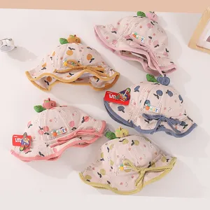 Detail of baby corduroy bucket hats with 3D fruit decorations and contrast binding edges