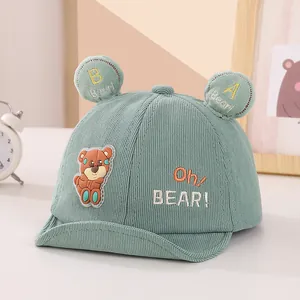 Detail of mint green corduroy baby baseball cap with 3D bear ears and embroidery