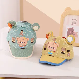 Detail view of cotton baby baseball caps with cute bear ears and smile embroidery