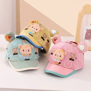 Corduroy baby baseball caps with 3D bear ears and smiling faces in cyan, yellow and pink