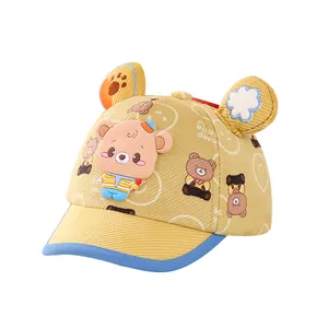 Cute ginger baby baseball cap featuring cartoon bear ears and smile print for toddlers