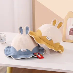 Cute kids bunny ear fisherman hats in blue and yellow color-block design for autumn winter