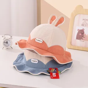 Cute waffle fabric baby bucket hat with rabbit ears and HEART tag in orange and blue
