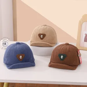 Corduroy baby baseball caps with C-letter patch in blue, beige, and coffee colors