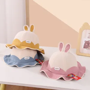 Close-up of corduroy toddler bucket hats with 3D bunny ears in various colors