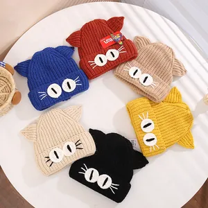 Detailed view of handmade knitted cat ear hats for kids in six vibrant various colors