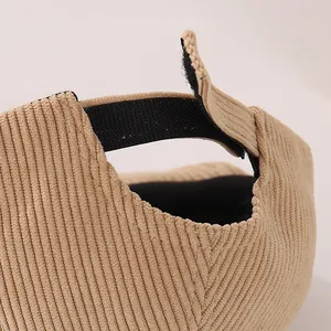 Detail view of khaki corduroy baby baseball cap with adjustable black velcro strap