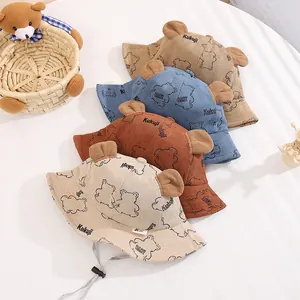 Detail of baby corduroy bucket hats with plush bear ears and adjustable windproof straps