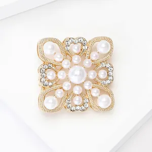 Baroque hollow gold brooch with white pearls and sparkling crystals in court style