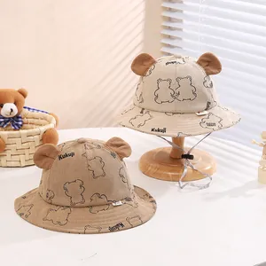 Cute baby corduroy bucket hat with 3D bear ears and chin strap in cream and brown