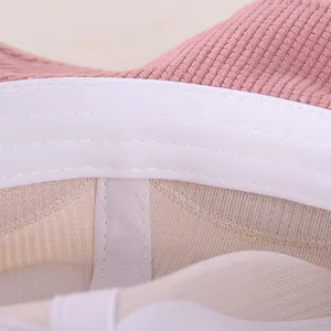 Detail of pink corduroy kids hat featuring breathable mesh lining and fine stitching