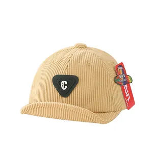 Beige corduroy baseball cap for toddlers featuring a letter C patch and soft brim