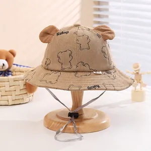 Detail of khaki corduroy baby bucket hat with bear ears and adjustable chin strap
