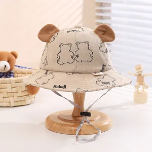 Detail of corduroy baby fisherman hat with bear ears and adjustable windproof strap