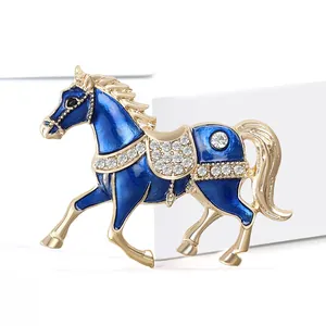 Deep blue enamel horse brooch with sparkling rhinestones and golden plating accents