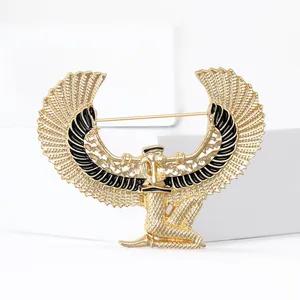 Golden Egyptian goddess brooch with wings and black enamel for unisex fashion wear
