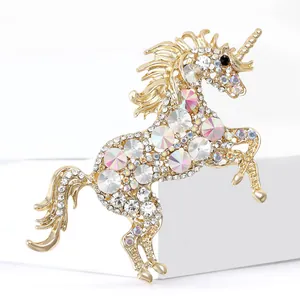 Golden unicorn brooch with shimmering rhinestones in a leaping pose for elegant apparel