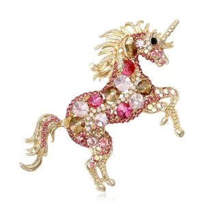 Exquisite gold-plated unicorn brooch with sparkling pink crystals and clear rhinestones