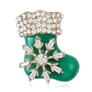 Exquisite gold-plated Christmas stocking brooch with green enamel and sparkling rhinestones
