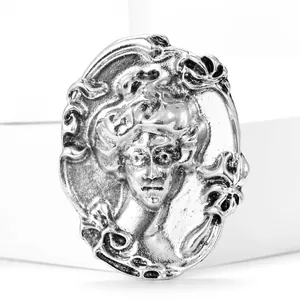 Vintage oval relief portrait brooch with sparkling rhinestones in baroque silver finish