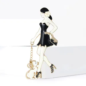 Fashionable enamel brooch of a woman with a small white dog and gold handbag