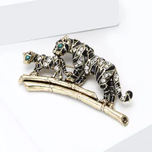 Vintage gold mother and baby tiger brooch with rhinestones on a bamboo branch