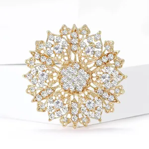 Exquisite gold hollow crystal flower brooch with shimmering rhinestones in vintage style