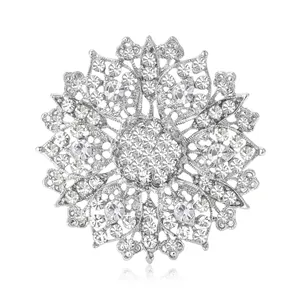 Elegant silver flower brooch with crystal rhinestones and hollow metal lace design