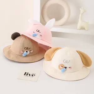 Set of three cartoon baby bucket hats with cute animal ears and soft cotton fabric