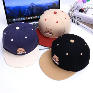 Child baseball cap with capybara patch and flat brim in contrast color patchwork style