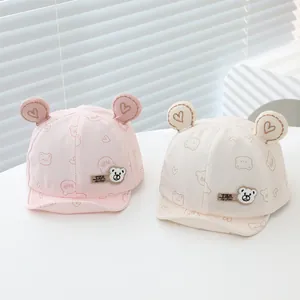 Soft cotton baby baseball caps with bear ears and heart prints in pink and beige