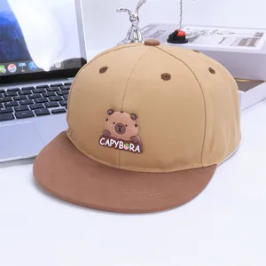 Detail of a color-block snapback hat with a 3D silicone capybara patch and air vents