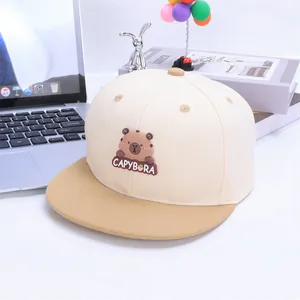 Detailed macro view of the 3D capybara patch and embroidery on a kids baseball cap