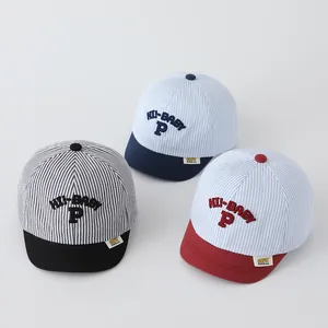 Detail of baby striped baseball caps showing soft brims and HI-BABY P embroidery