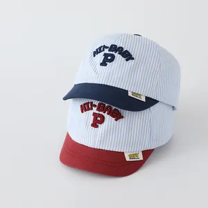 Close-up of blue and red striped baby baseball caps with HI-BABY P embroidery