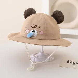 Detail of baby khaki sun hat with cute bear ears and adjustable chin strap