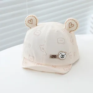 Detail of baby baseball cap featuring 3D bear ears and cute heart patterns