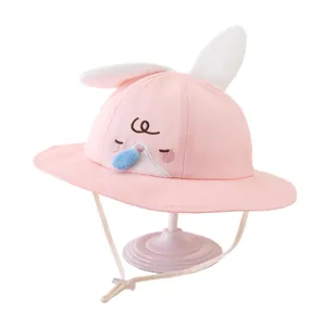Pink baby sun hat with cute 3D bunny ears and adjustable chin strap for summer