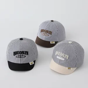 Detailed embroidery on striped toddler baseball caps in black, coffee, and beige colors