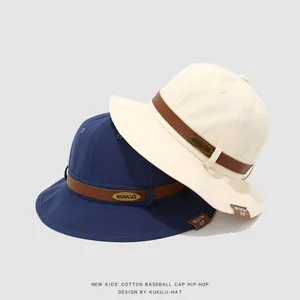 Minimalist cotton kids fisherman hats in navy and cream with leather strap and metal plate