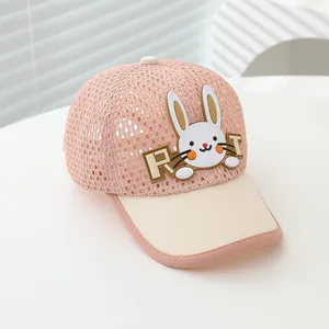 Detail of pink mesh fabric and cute white rabbit patch on the children baseball cap