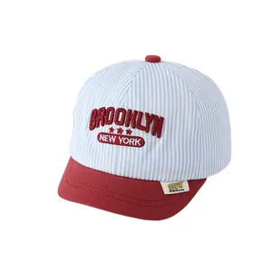 Kids baseball cap with red, blue, and white stripes featuring Brooklyn embroidery
