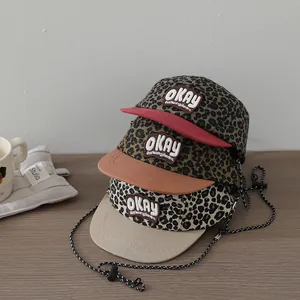 Kids leopard print baseball caps with embroidery patches and adjustable chin straps