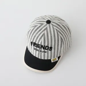 Detail of baby striped baseball cap with FRIENDS 3D embroidery and cotton texture