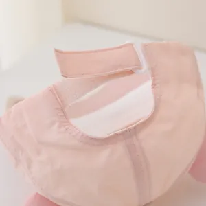 Detail of pink quick-dry baseball cap with adjustable velcro strap and plastic buckle