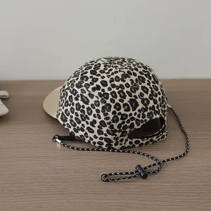 Detail of five-panel leopard print kids baseball cap with adjustable windproof drawstring